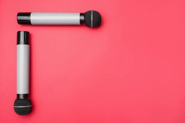 Modern microphones on color background — Stock Photo, Image