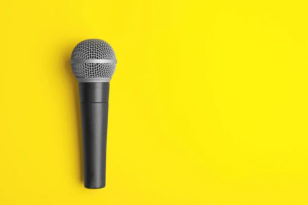 Modern microphone on color background — Stock Photo, Image