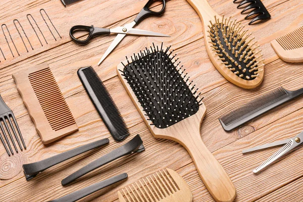 Set of hairdresser tools on wooden background — Stock Photo, Image