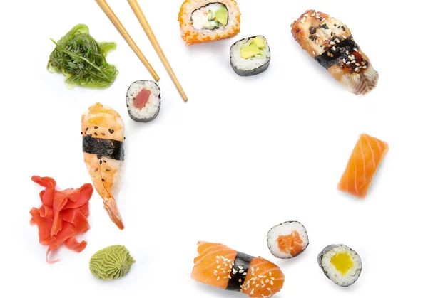 Složení s různými sushi na bílém pozadí — Stock fotografie