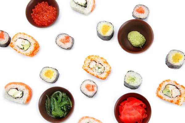Composición con diferentes sushi sobre fondo blanco — Foto de Stock