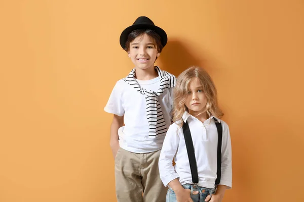 Stylish little children on color background — Stock Photo, Image