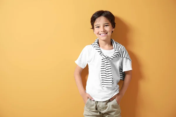 Stylish little boy on color background — Stock Photo, Image