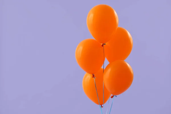 Bright balloons on color background — Stock Photo, Image