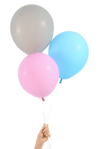 Female hand with balloons on white background — Stock Photo, Image