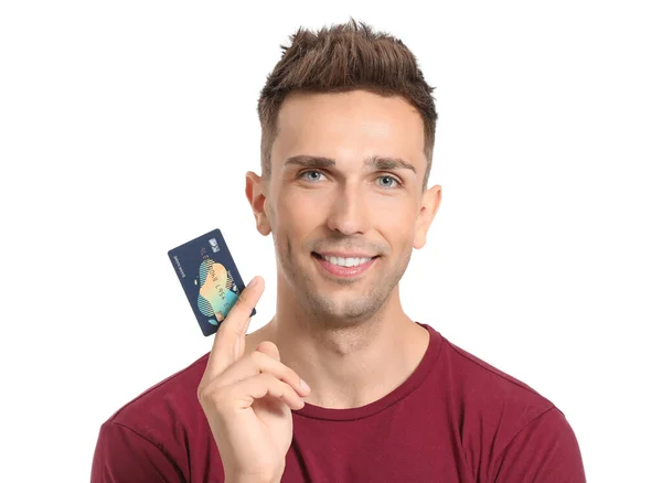 Young man with credit card on white background — Stock Photo, Image