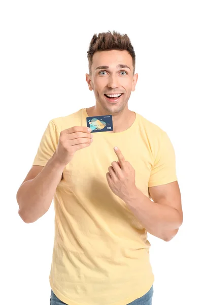 Young man with credit card on white background — Stock Photo, Image