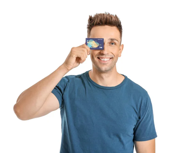 Young man with credit card on white background — Stock Photo, Image