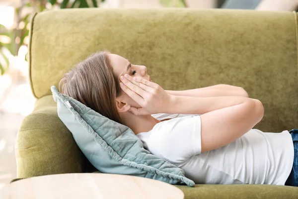 Young woman suffering from headache at home — Stock Photo, Image