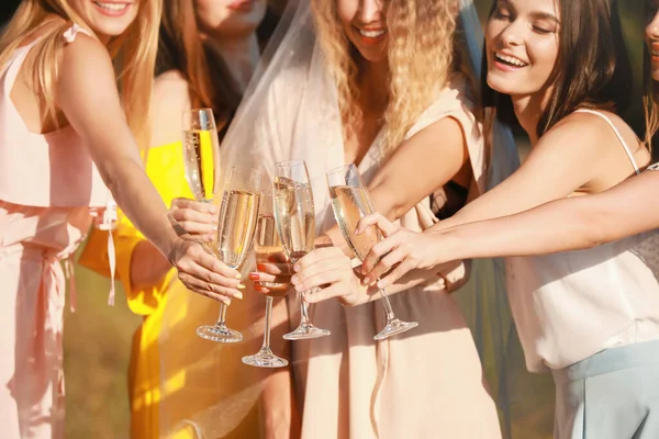 Beautiful young women with champagne at hen party outdoors — Stock Photo, Image