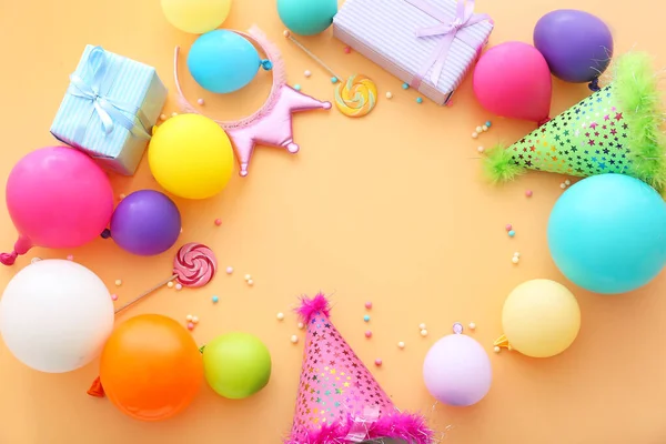 Composition with balloons, party decor and place for text on color background