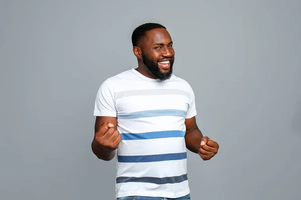 Happy African-American man on grey background — Stock Photo, Image