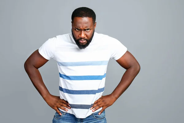 Angry African-American man on grey background — Stock Photo, Image