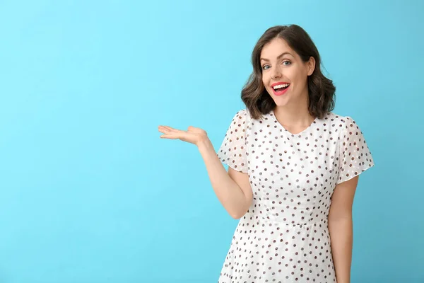 Happy young woman on color background