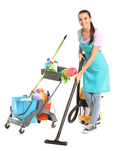 Female janitor with cleaning supplies on white background — Stock Photo, Image