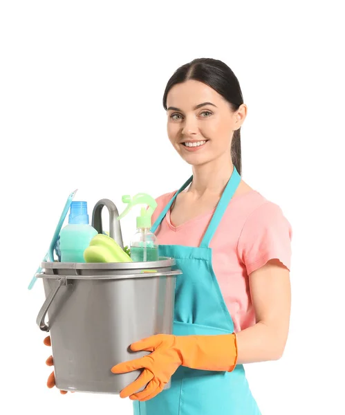 Female janitor with cleaning supplies on white background — Stock Photo, Image