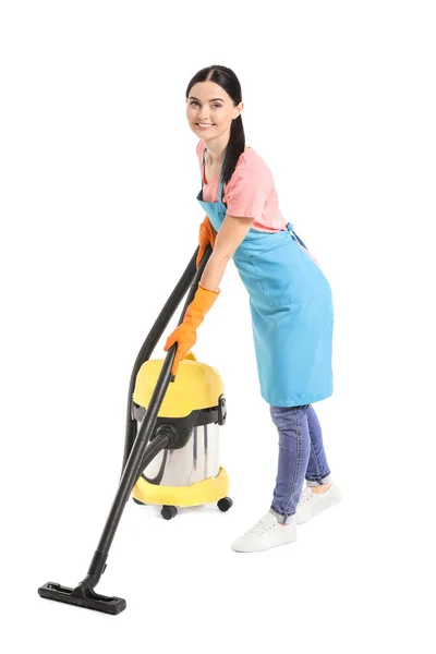 Janitor feminino com aspirador de pó no fundo branco — Fotografia de Stock