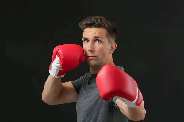 Sporty male boxer on dark background — ストック写真