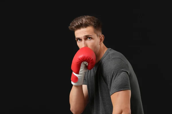 Sporty male boxer on dark background — ストック写真