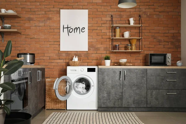 Interior of kitchen with modern washing machine — Stock Photo, Image