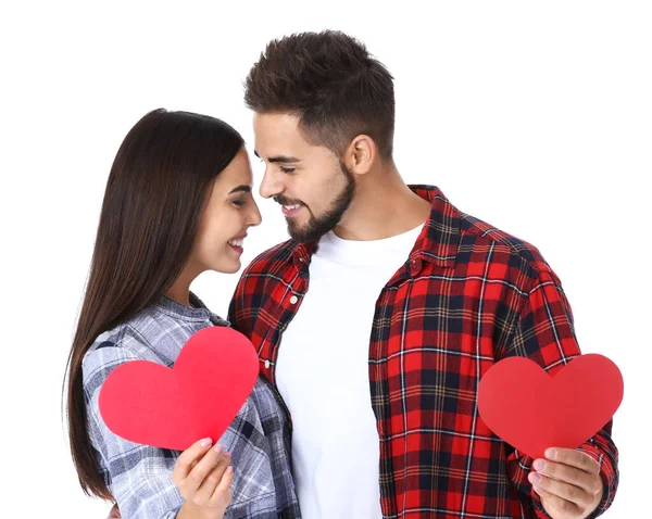 Portrait of beautiful young couple with paper hearts on white background — Stock Photo, Image