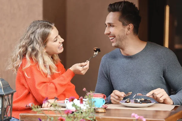 Happy young couple on romantic date in cafe — Stock Photo, Image