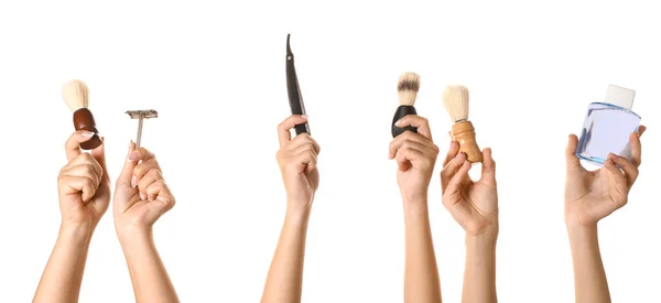 Mãos com diferentes ferramentas para barbear no fundo branco — Fotografia de Stock