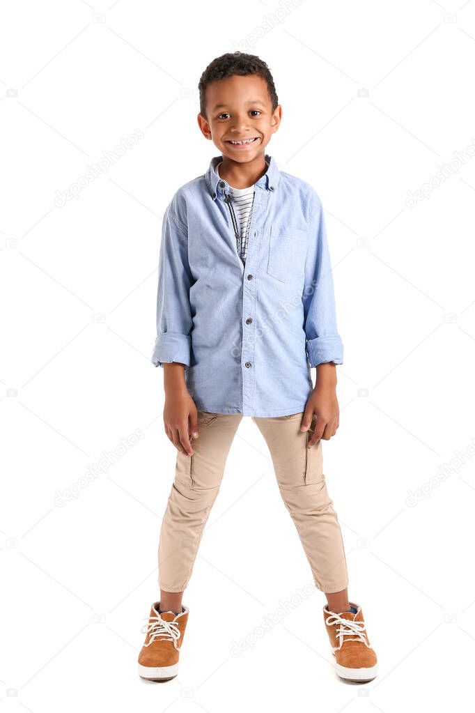 Fashionable African-American boy on white background
