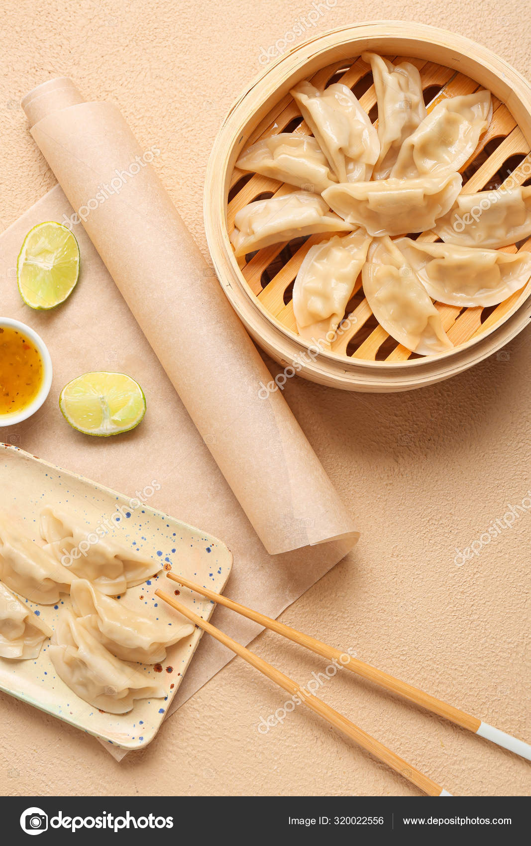 Bamboo steamer with tasty Japanese gyoza on light background Stock
