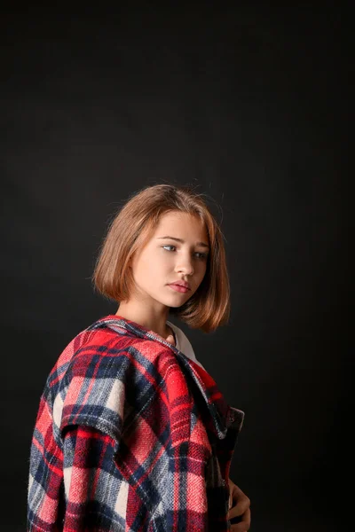 Cute teenage girl on dark background — Stock Photo, Image