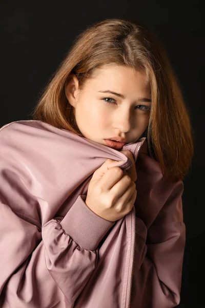 Sad teenage girl on dark background — Stock Photo, Image