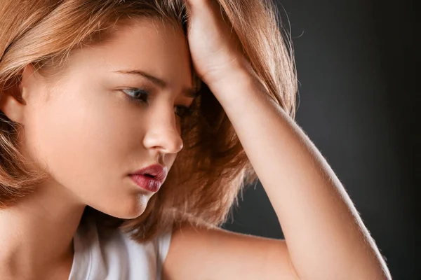 Sad teenage girl on dark background, closeup — Stock Photo, Image