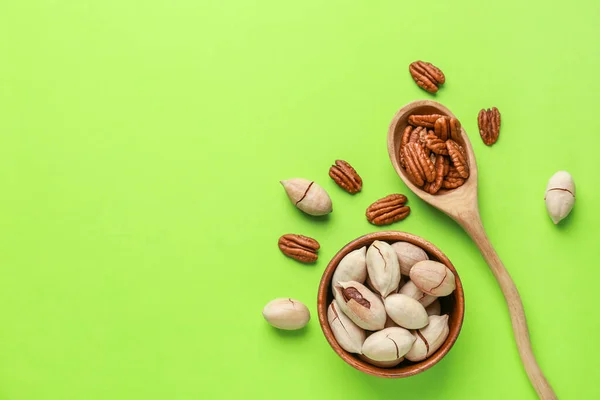 Tasty pecan nuts on color background — Stock Photo, Image