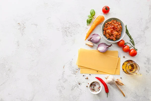 Ingredients for lasagna on white background — Stock Photo, Image