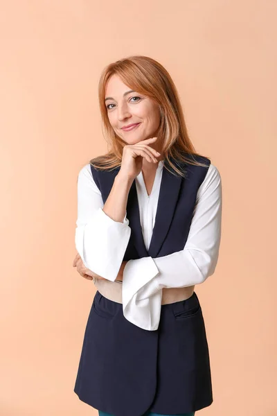 Stylish mature businesswoman on color background — Stock Photo, Image