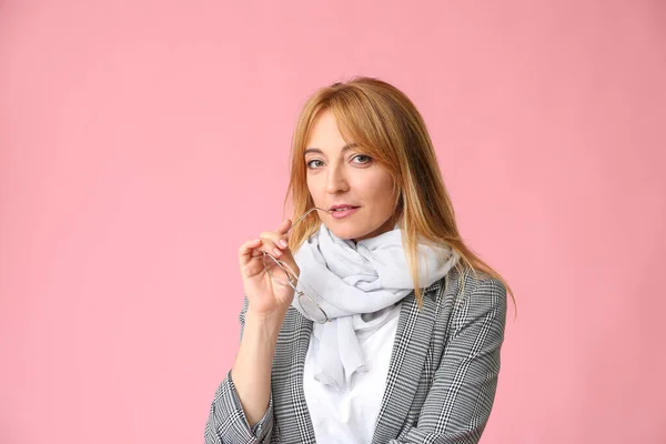 Stylish mature woman on color background — Stock Photo, Image