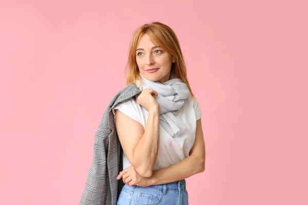 Stylish mature woman on color background — Stock Photo, Image