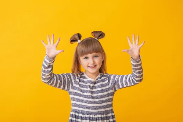 Cute little girl on color background — Stock Photo, Image