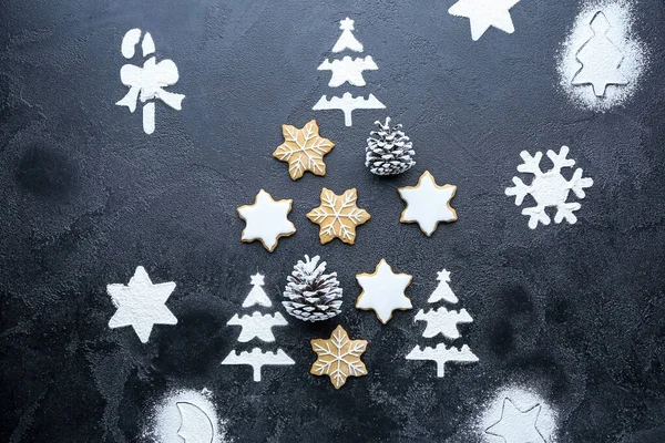 Christmas tree shape made of tasty cookies on dark background — Stock Photo, Image