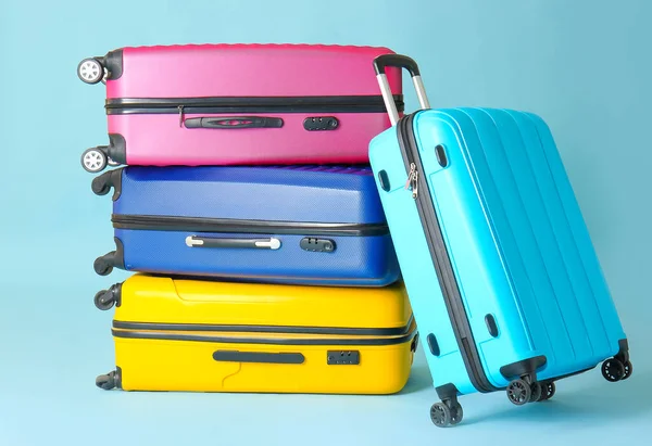 Packed suitcases on color background. Travel concept — Stock Photo, Image