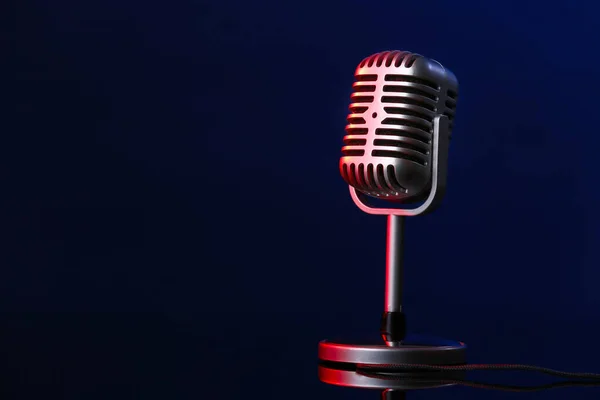 Retro microphone on dark color background — Stock Photo, Image