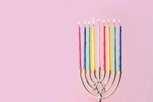 Menorah with candles for Hanukkah on color background — Stock Photo, Image