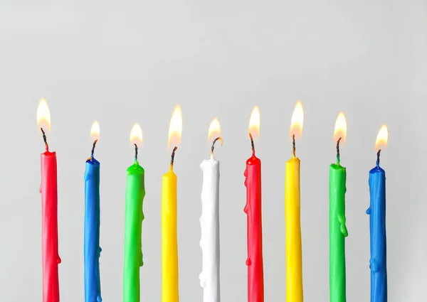 Burning candles for Hanukkah on light background — Stock Photo, Image