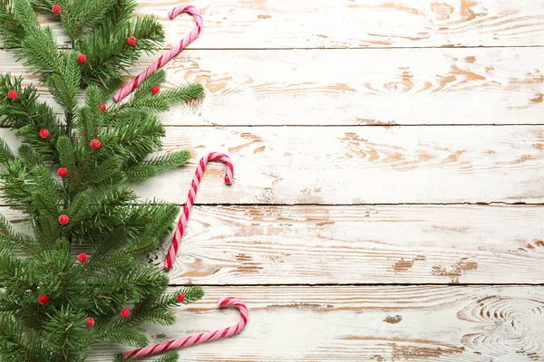 Composition with beautiful Christmas tree branches on wooden background — Stock Photo, Image