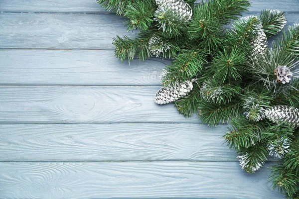 Composition with beautiful Christmas tree branches on wooden background — Stock Photo, Image