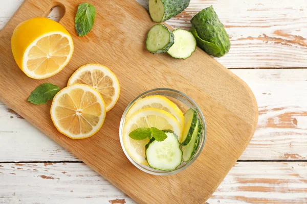 Glass of healthy infused water on wooden table — Stock Photo, Image