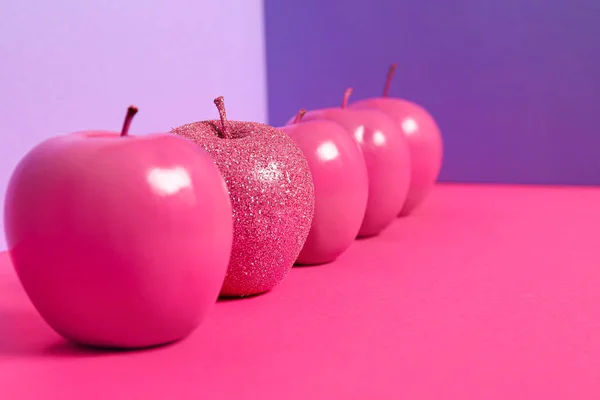 Apples on color background. Concept of uniqueness — Stock Photo, Image