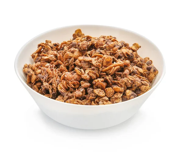 Schaal met smakelijke granola op witte achtergrond — Stockfoto