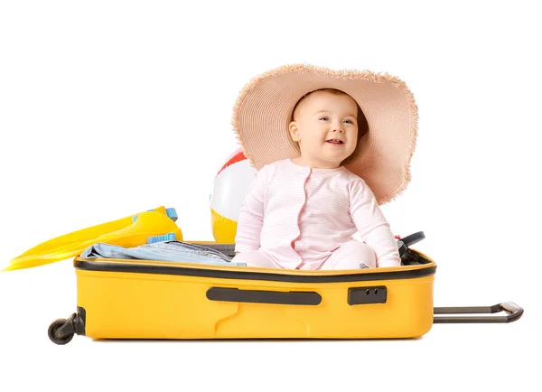 Bambino carino con valigia e oggetti su sfondo bianco — Foto Stock