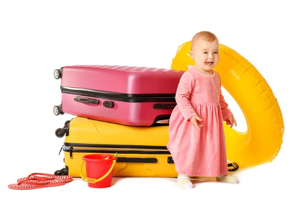 Cute baby with suitcases and inflatable ring on white background — Stock Photo, Image